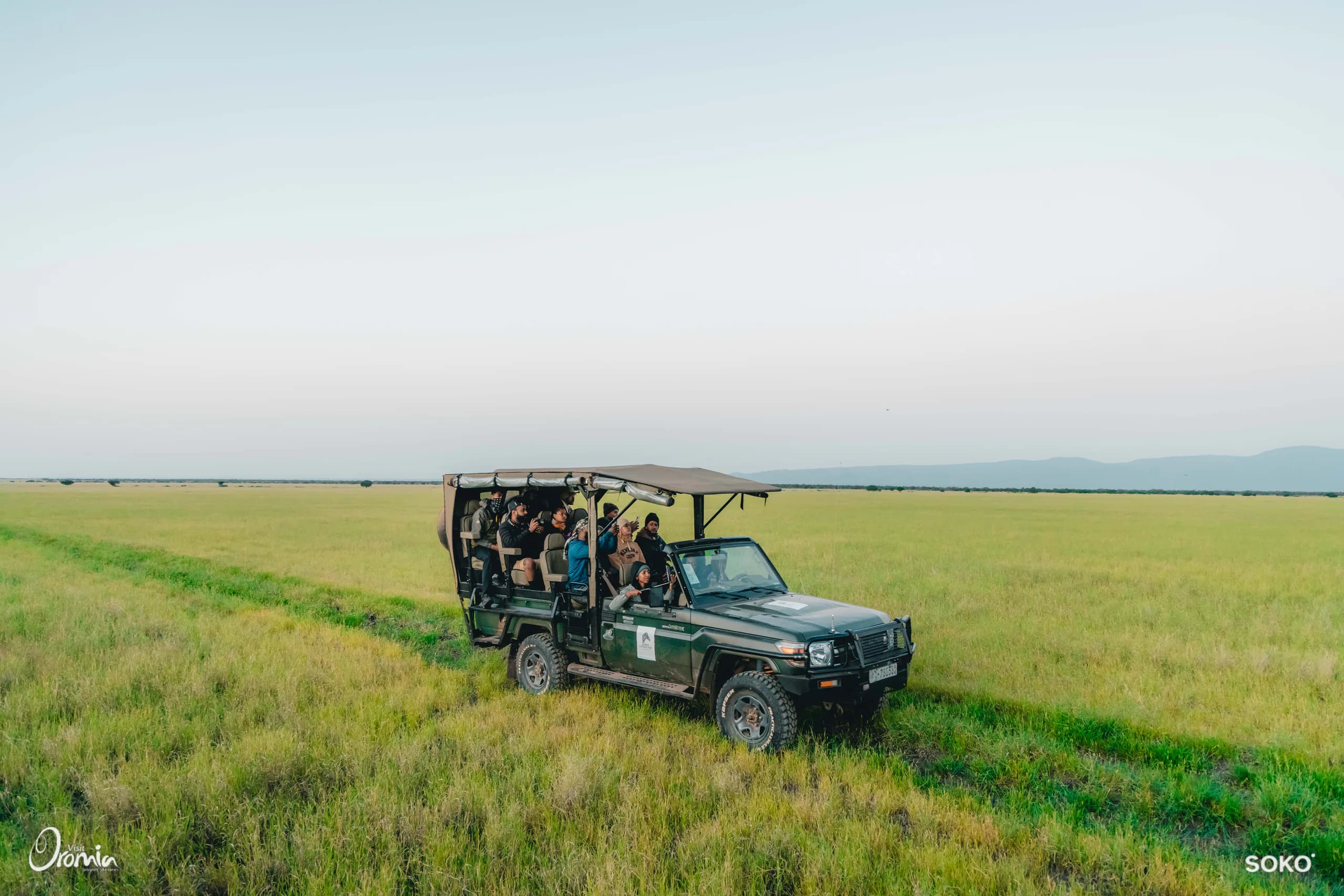Travelers on safari across the Oromia grasslands